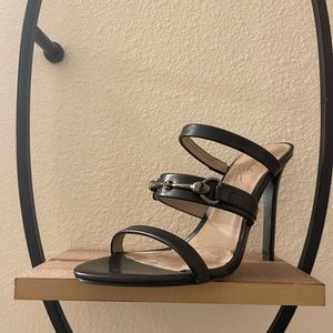 Donald Pliner black Horsebit heels.